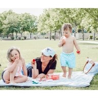 Mom with kids having outdoor picnic on Grey Nook Lilypad2 Best Baby and Toddler Play mat