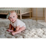 Baby girl sitting on Grey Nook Lilypad2 Best Baby and Toddler Play mat