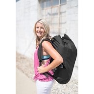 Woman carrying backpack for Grey Nook Lilypad2 Best Baby and Toddler Play mat